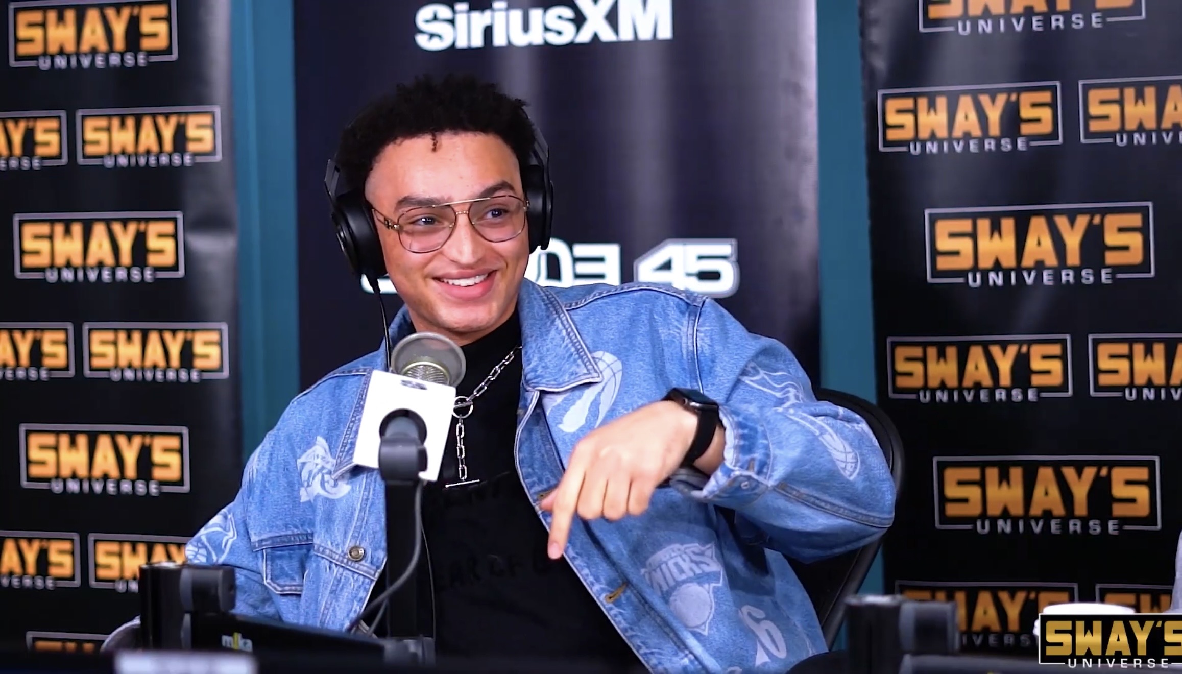 Nic smiling at the microphone on SiriusXM’s Sway’s Universe.